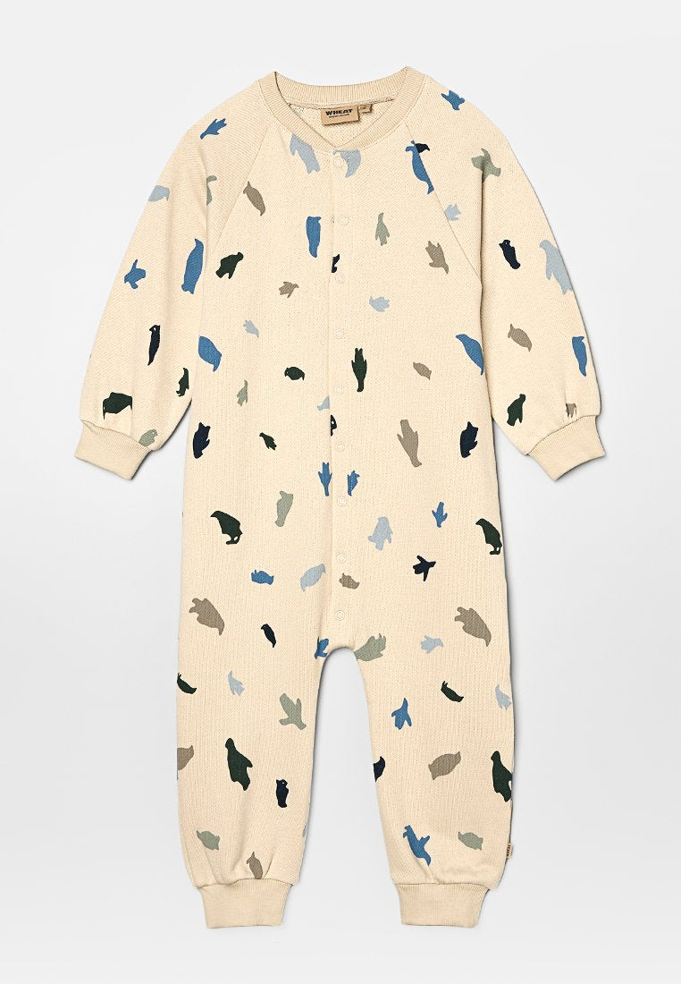 Beige Ripp-Overall mit mehrfarbigen abstrakten Formen in Blau, Grün und Schwarz. Verfügt über eine Knopfleiste vorne und cuffed Ärmel.