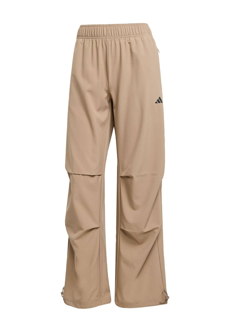 Beige Sporthose aus glattem Stoff mit elastischem Bund, Logodetail und Reißverschlussöffnungen am Saum zur Anpassung.