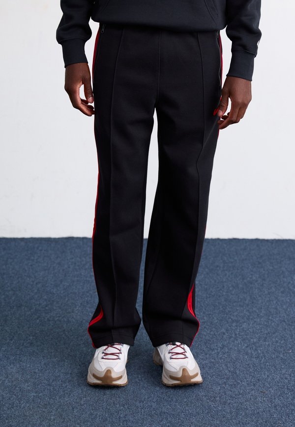 Nike Sportswear Tracksuit bottoms - black/light crimson