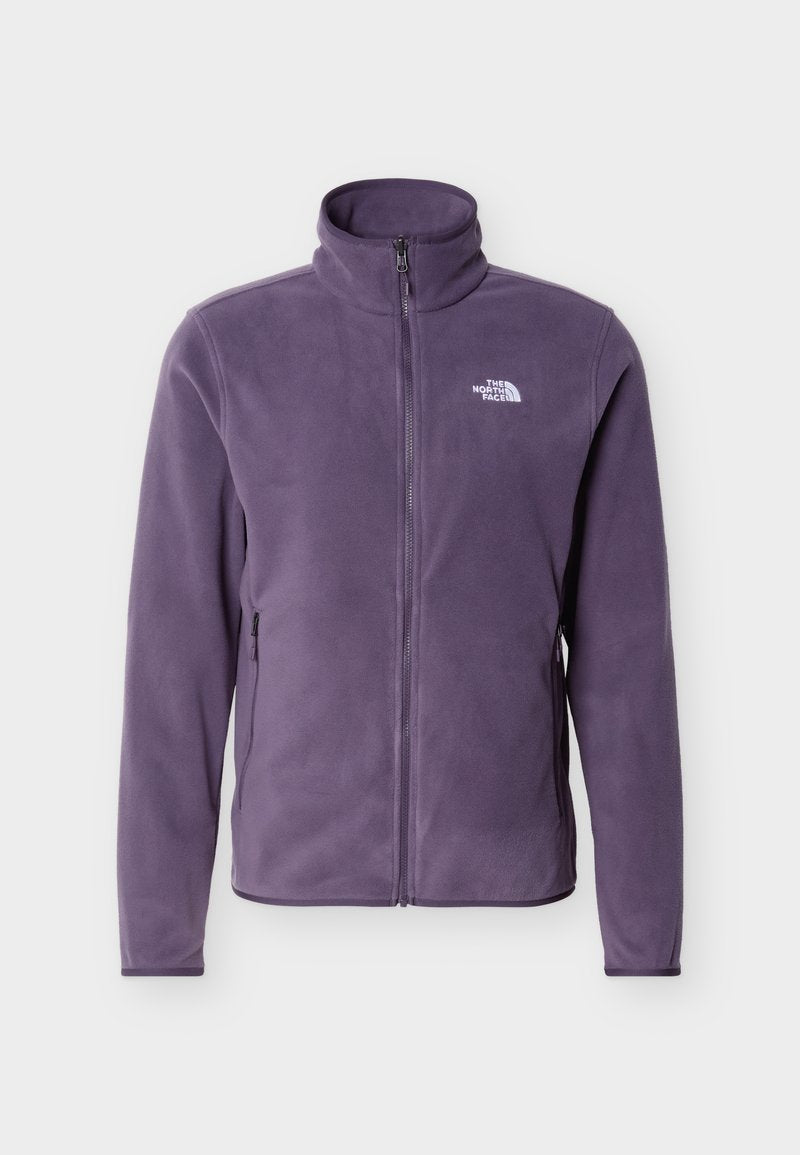 Lila Fleecejacke mit Reißverschluss, Stehkragen, seitlichen Reißverschlusstaschen und weißem "The North Face"-Logo auf der linken Brust.