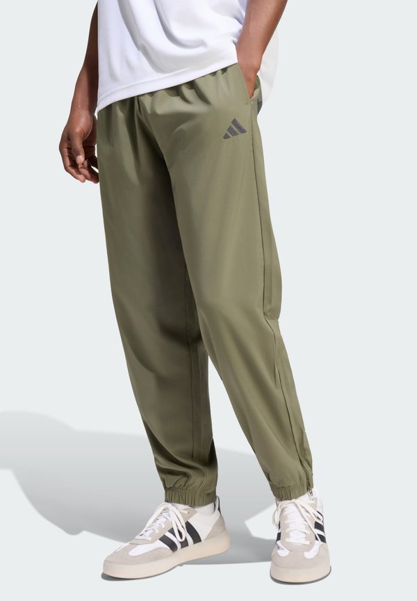 adidas Sportswear Tracksuit bottoms - olive four/black