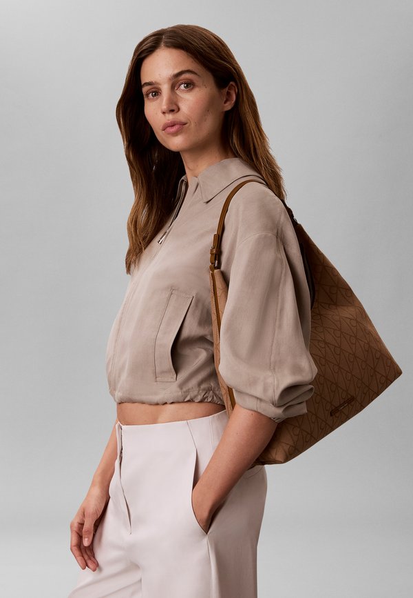 Calvin Klein EMBLEM JACQUARD - Handbag - beige