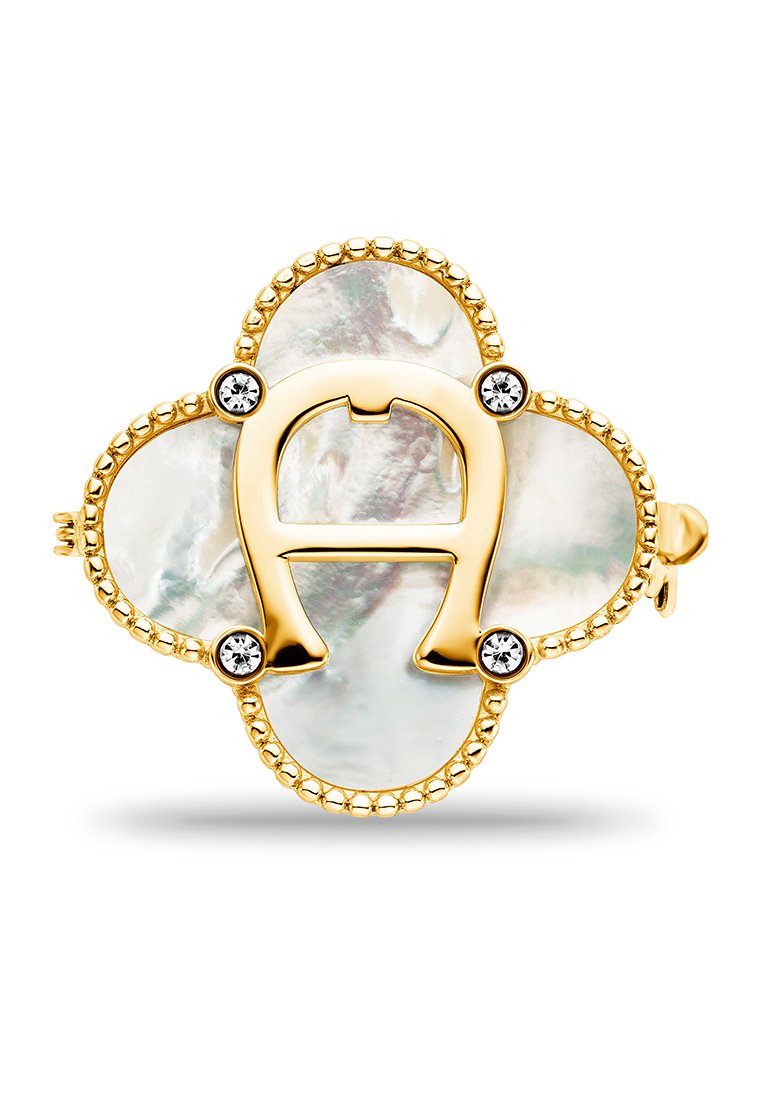 Goldfarbener Schmuck mit einem ovalen, schimmernden Perlmuttmittelstück, das ein "A"-Design zeigt, umgeben von einem Perlenrahmen und klaren Akzenten.