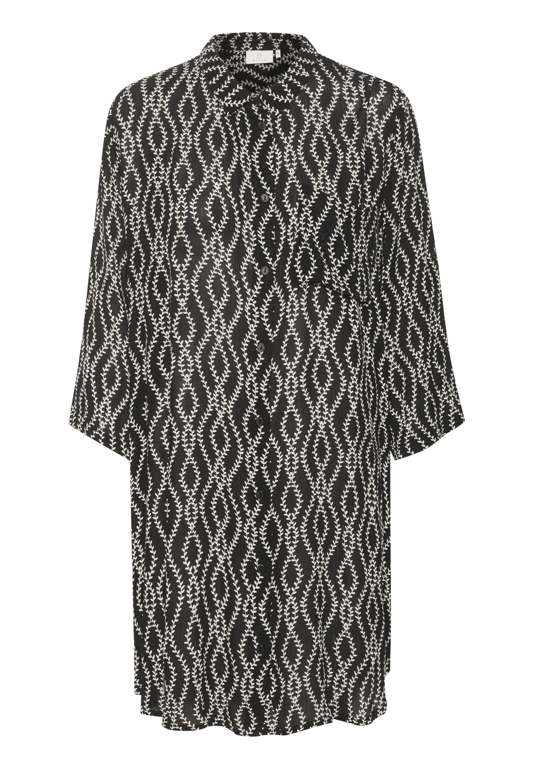 Schwarz-weiße Kurzarmhemdkleid mit einem Blattmuster, lockerer Passform, umgeschlagenen Ärmeln und einem Kragen. Hergestellt aus einem leichten Stoff.
