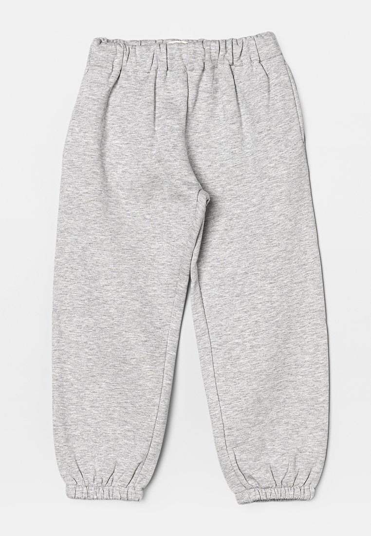Graue Jogginghosen aus weichem, strukturiertem Stoff. Mit einem elastischen Bund und elastischen Bündchen an den Knöcheln. Lässiger, lockerer Schnitt.