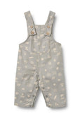 Graue Baumwolllatzhose mit weißen Mustern von Sonne, Wellen und Muscheln. Verfügt über Knopfträger, eine Fronttasche und Druckknöpfe an den Beinen.