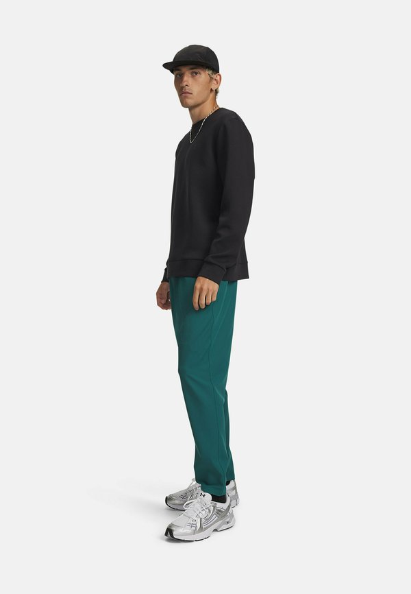 Under Armour UNSTOPPABLE - Tracksuit bottoms - rack green