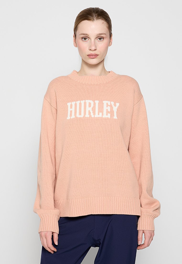 Helles rosa gestricktes Sweatshirt mit "HURLEY" in weißen Buchstaben, gerippten Bündchen und Saum, lockerem Schnitt, rundem Halsausschnitt und überschnittenen Schultern.