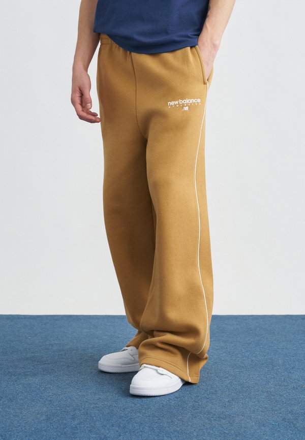 New Balance LINEAR GRAPHIC PANT - Tracksuit bottoms - brown