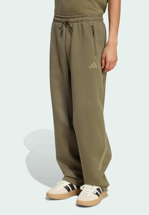 adidas Sportswear Z.N.E. OPEN HEM - Tracksuit bottoms - olive strata