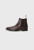 Braune Leder-Ankle-Boots mit elastischen Seitenpaneelen und einem Zugband. Glatte Textur, abgerundete Zehenform und einen niedrigen, gestapelten Absatz.