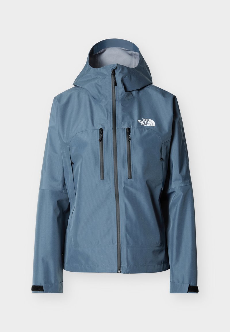 Blaue wasserdichte Kapuzenjacke mit Frontreißverschluss, Brusttaschen mit Reißverschluss, Klettverschlüssen an den Handgelenken und weißem "The North Face"-Logo auf der Brust.