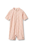 Kurzarmpullover in Rosa aus elastischem Stoff, mit floralem Muster, Frontreißverschluss und elastischem Saum für ein einfaches An- und Ausziehen.