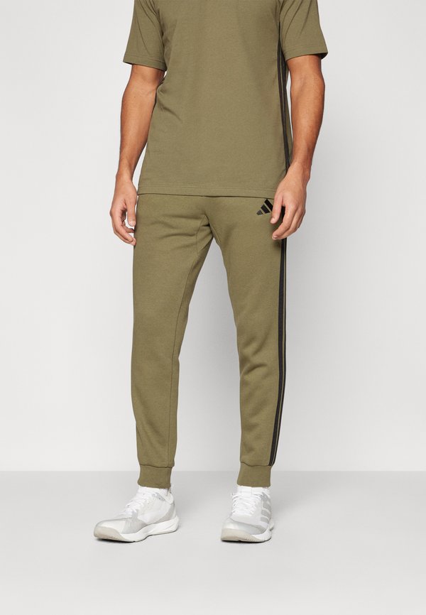 adidas Sportswear REGULAR FIT - Tracksuit bottoms - olive strata/black