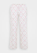 Weiße Schlafanzughose mit floralem Muster in Rosa und Grün, mit Schleifen und elastischem Bund. Gerade geschnittener Beinverlauf, weiche Stoffstruktur.