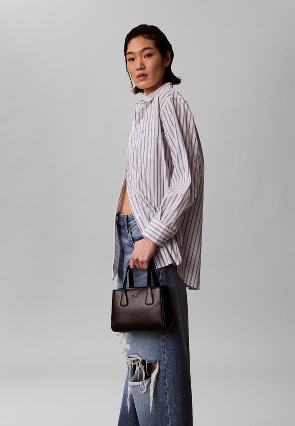 Calvin Klein MINI TOTE CROSSBODY - Handbag - black