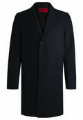 Navy-Wollmantel mit Reverskragen, einreihigem Design, zwei Vordertaschen und Knopfverschluss. Futter ist dunkel mit sichtbarerer Markenetikett.