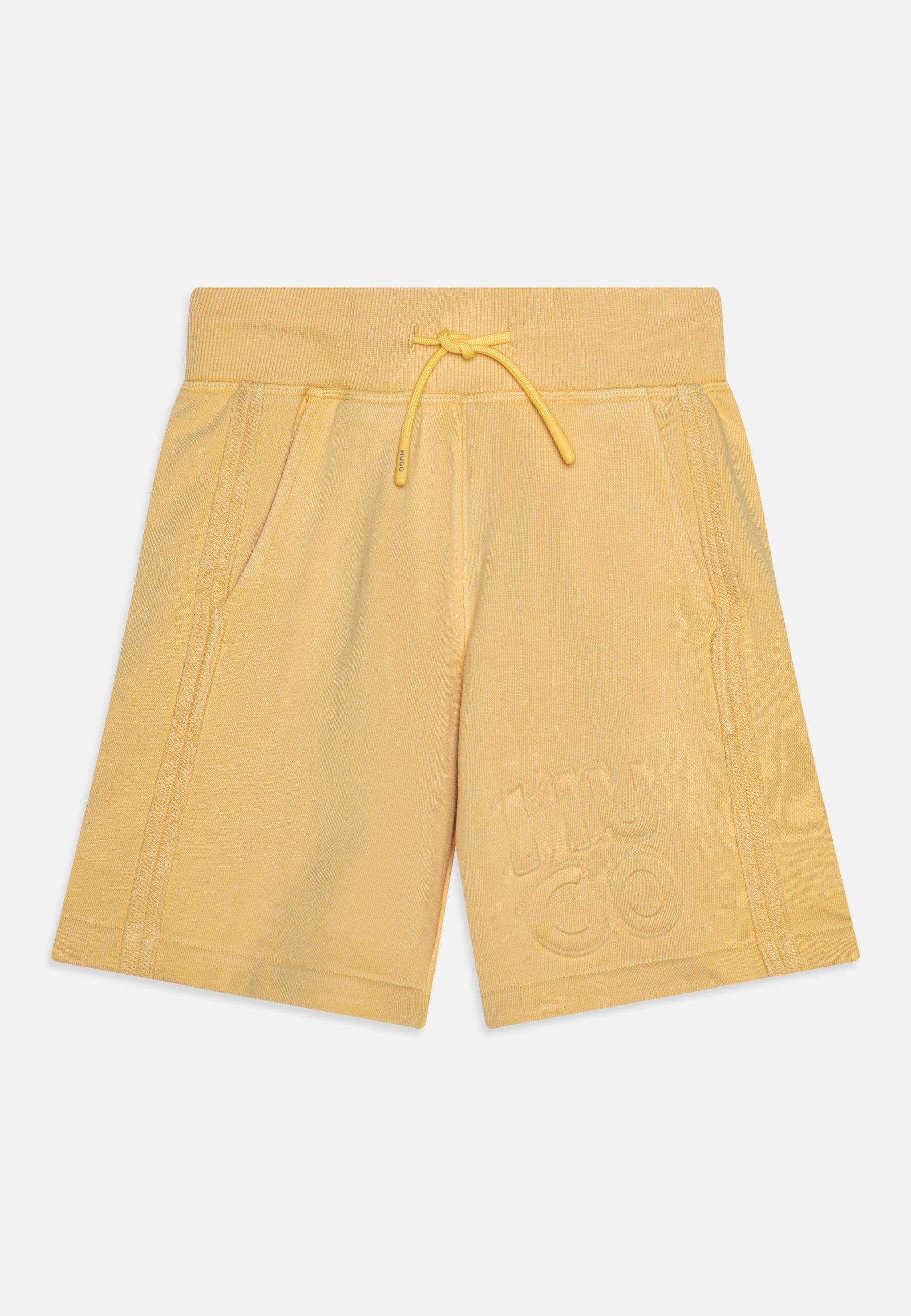 Gelbe Baumwollshorts mit elastischem Bund, Kordelzug, Seitentaschen und geprägtem "HUGO"-Logo am linken Bein. Weicher Stoff.