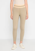 Beige Leggings mit einem hohen, strukturierten Bund, der in hellorange und grau gestreift ist. Hergestellt aus dehnbarem Material, das für Komfort sorgt.