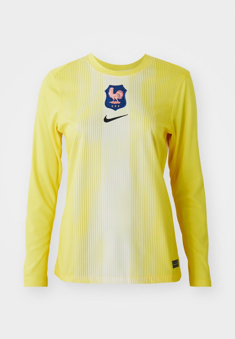 Langarm-Nike-Trikot in leuchtendem Gelb mit vertikalen Streifen, verfügt über ein blaues Emblem mit einem Hahn und einem schwarzen Swoosh-Logo.