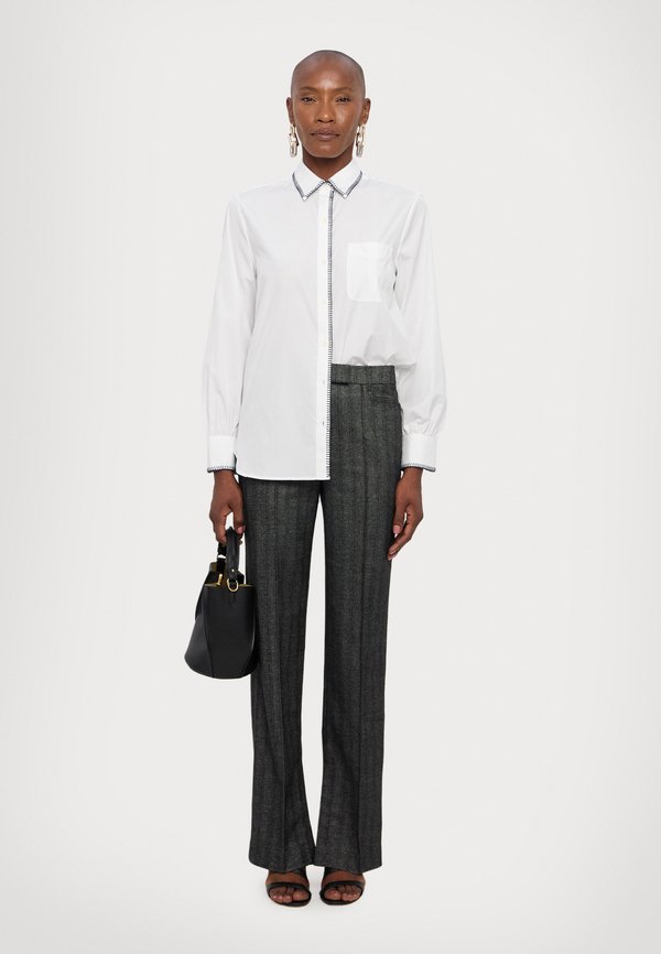 REMAIN STRIPED SLIM PANTS