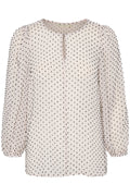 Bluse aus leichtem Stoff in sanftem Beige mit schwarzen Pünktchen, Ballonärmeln und einem Ausschnitt mit Schlüsselloch-Detail.