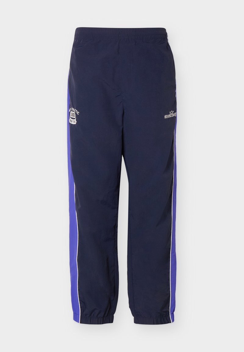 Marineblaue Sporthose mit elastischem Bund und Bündchen, violette Seiteneinsätze und weiße Logo-Patches an den Oberschenkeln.