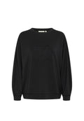 Schwarzes Sweatshirt aus weichem Stoff, mit Rundhalsausschnitt, lange Fledermausärmel und einem geprägten Logo in der Mitte.