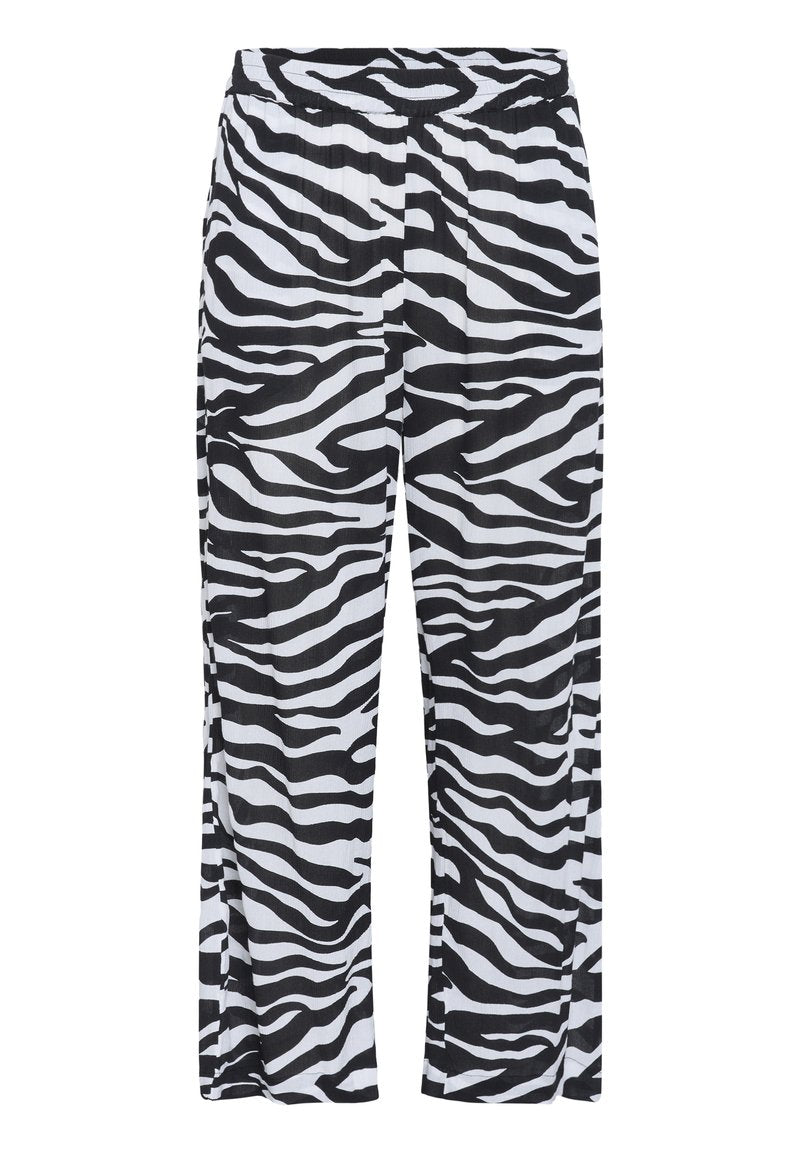 Schwarz-weiße Zebra-Print-Hosen mit elastischem Bund, weitem Bein und einem leichten, strukturierten Stoff.