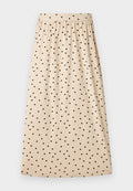 Beiger Midirock mit schwarzen Polka-Dots, gerafftem Bund und A-Linien-Silhouette auf einfachem Hintergrund.