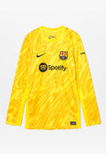 Gelbes Langarm-Fußballtrikot mit einem strukturierten, abstrakten Muster, einem schwarzen Nike-Logo und dem Barcelona-Abzeichen sowie dem Spotify-Logo auf der Brust.