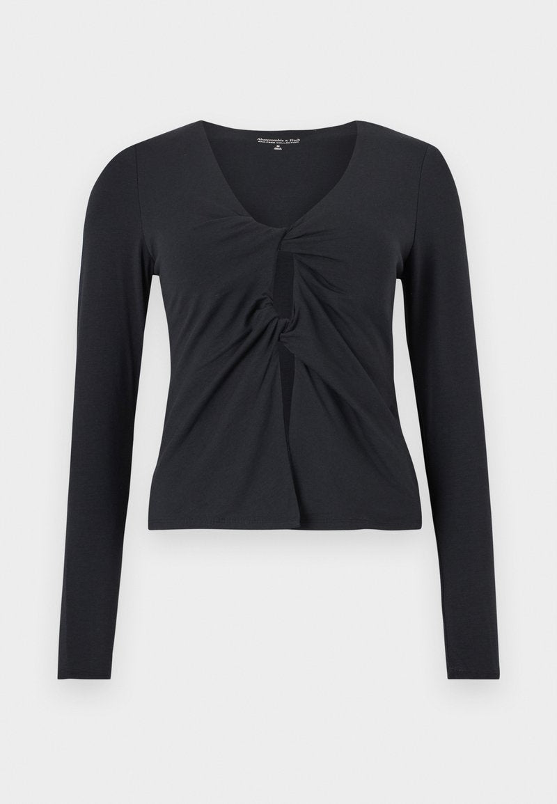 Schwarzes langärmeliges Crop-Top mit gedrehtem Knoten und Schlüsselloch-Detail vorne sowie V-Ausschnitt.