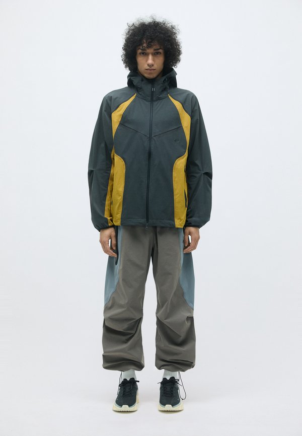 Nike Sportswear TECH PRO JACKET - Windbreaker - anthracite/ochre/(black)