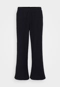 Schwarze, ausgestellte Hosen aus einem strukturierten Stoff mit einem elastischen Bund. Das Design ist bodenlang mit einem weichen Finish.