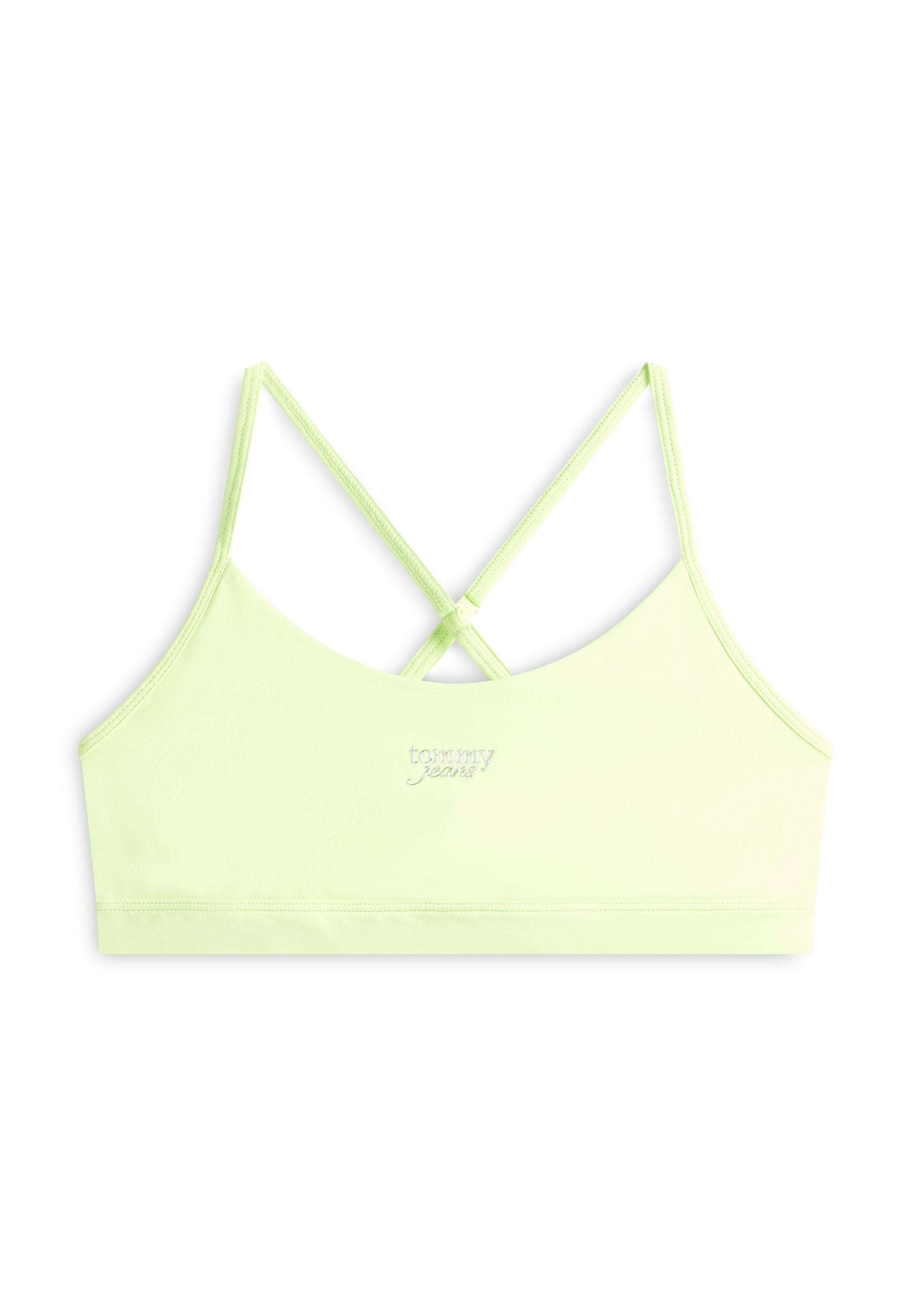 Hellgrünes bauchfreies Tanktop mit dünnen, überkreuzten Trägern und kleinem "tommy jeans"-Logo mittig auf der Vorderseite.