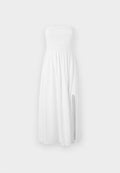 Weißes trägerloses Kleid aus leichtem Stoff. Besitzt einen gerafften Oberkörper und einen seitlichen Schlitz für zusätzliche Details. Die Länge reicht bis unter das Knie.