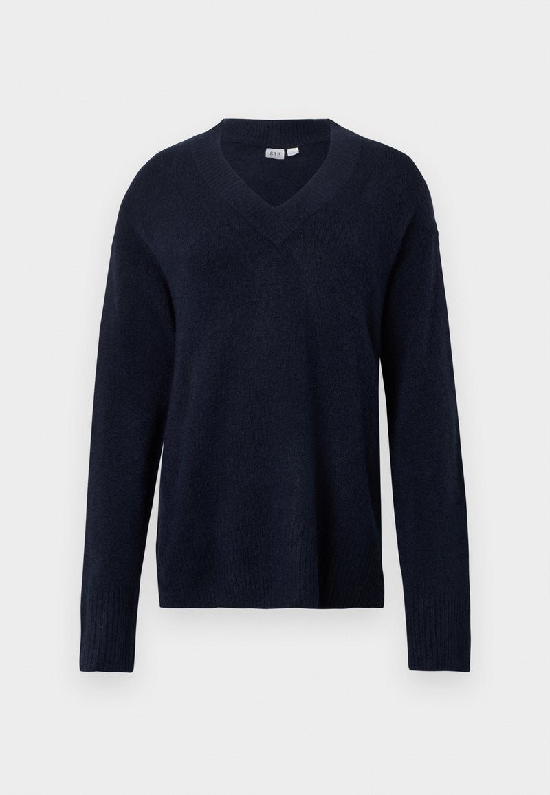 Marineblauer V-Ausschnitt-Pullover aus weichem Strickstoff. Mit langen Ärmeln sowie gerippten Bündchen an Ärmeln und Saum. Einfaches und klassisches Design.