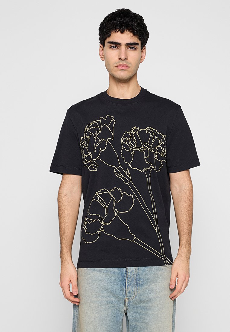 Schwarzes Baumwoll-T-Shirt mit einer Linienzeichnung von Blumen in Beige auf der Vorderseite. Kurze Ärmel und runder Ausschnitt. Lässige Passform.