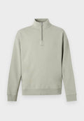 Hellgrüner Pullover mit langen Ärmeln, hohem Kragen und kurzem Reißverschluss, mit dezentem "HUGO" Schriftzug auf der Brust.