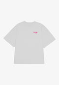 Hellgraues, übergroßes T-Shirt mit kurzen Ärmeln und Rundhalsausschnitt. Auf der linken Seite befindet sich ein kleines pinkes "PEGADOR"-Logo. Weicher Stoff.