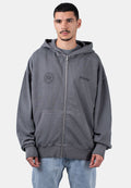 Graue Zip-Hoodie mit einer großen Fronttasche, gerippten Bündchen und dem auf der Brust und dem Ärmel aufgedruckten "PEGADOR"-Logo. Aus Baumwollmaterial.