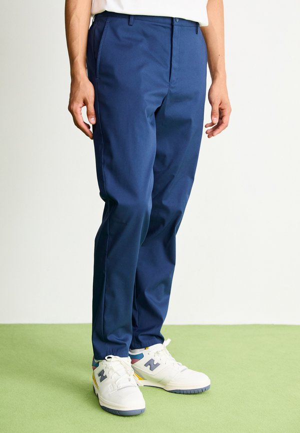 New Balance ATHLETICS STANDARD TAPERED PANT 30" - Chinos - navy