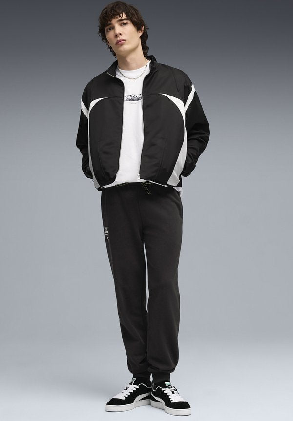 Puma ASTON ARAMCO TEAM ESSENTIALS JOGGING - Tracksuit bottoms - black