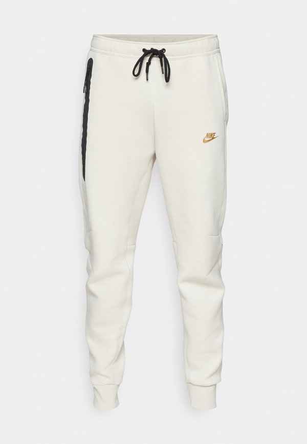 Nike Sportswear TECH JOGGER - Tracksuit bottoms - lt orewood brn/(metallic gold)