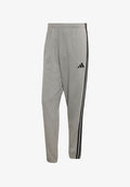 adidas Sportswear ESSENTIALS 3-STRIPES FRENCH TERRY TAPERED CUFFED PANTS - Tracksuit bottoms - medium grey heather/black