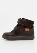 Dunkelbraune Lederstiefelette mit Suede-Akzenten, zwei verstellbaren Klettverschlüssen, strukturiertem Gummisohle und einem kleinen orangefarbenen Etikett mit der Aufschrift "TEX."