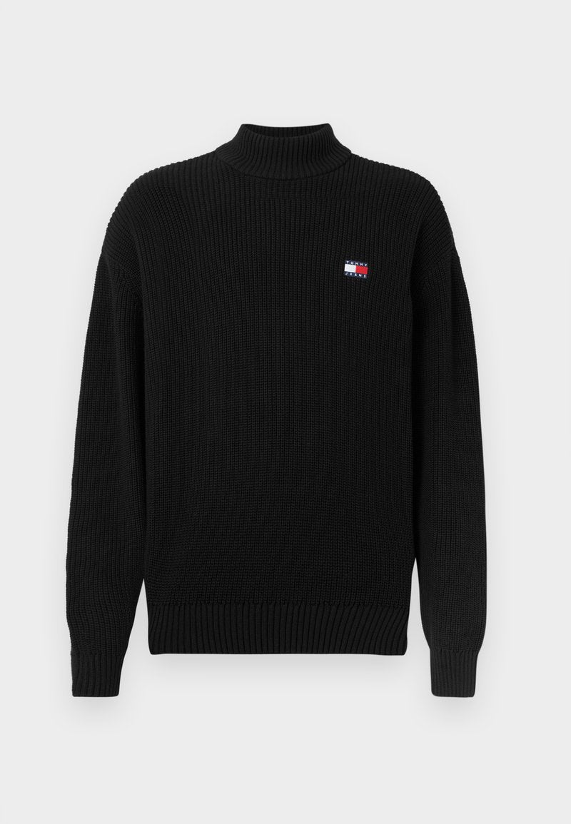 Schwarzer, gestrickter Rollkragenpullover mit geribbeltem Muster und lockerer Passform. Verfügt über ein kleines, buntes Logo-Patch auf der linken Brust.