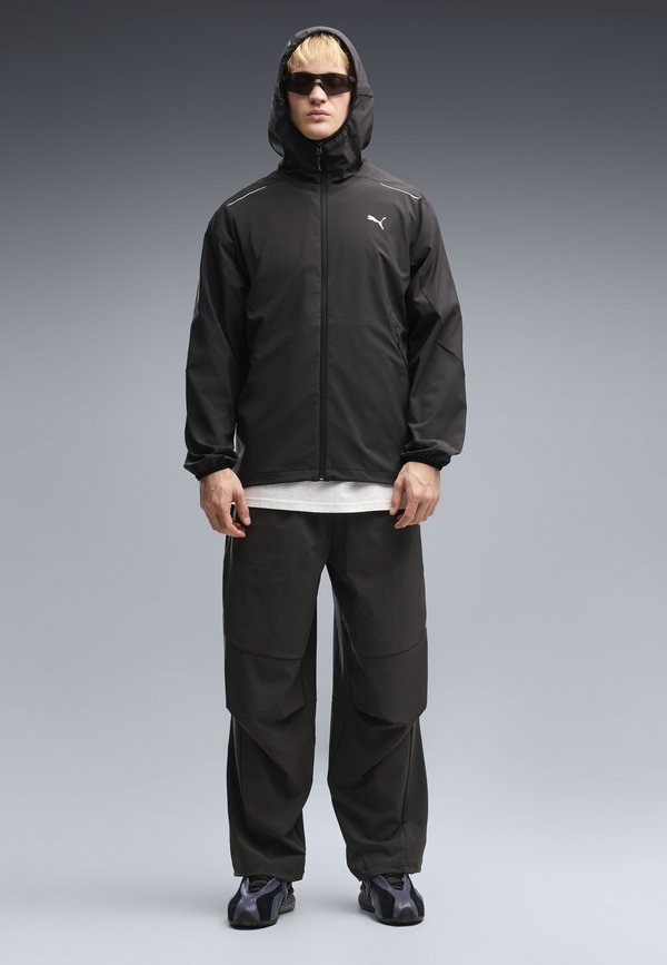 Puma PUMATECH 4-WAY STRETCH RELAXED WOVEN TRACK JACKET UNISEX - Training jacket - puma black