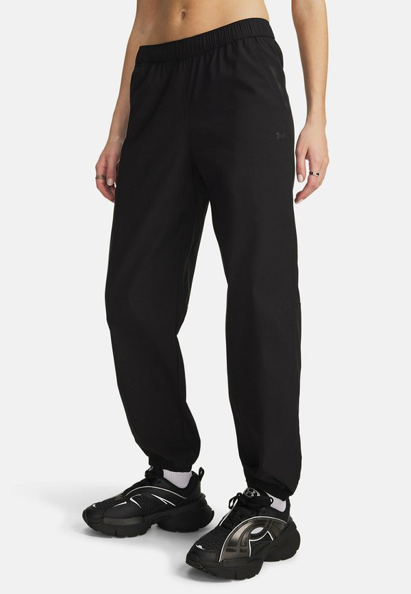 Under Armour UNSTOPPABLE WOVEN - Tracksuit bottoms - ultimate black