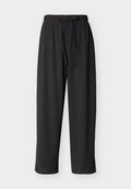 Schwarz strukturierte Loose-Fit-Hose mit elastischem Bund und Kordelzug, gerades Bein, geeignet für Freizeitkleidung.